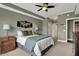 Cozy bedroom featuring a comfortable bed, stylish decor, and a view into an adjoining space at 20971 Shoreline Ct # 306, Noblesville, IN 46062