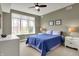 Bright bedroom with a large window offering scenic views, a comfortable bed and stylish side tables at 20971 Shoreline Ct # 306, Noblesville, IN 46062
