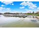Community boat docks and harbor on a sunny day with fluffy white clouds at 20971 Shoreline Ct # 306, Noblesville, IN 46062