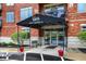 Inviting building entrance with awning, bench seating and beautiful landscaping with views of Morse Lake at 20971 Shoreline Ct # 306, Noblesville, IN 46062