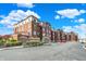 Expansive view of the condo complex with private balconies, green landscaping and ample parking at 20971 Shoreline Ct # 306, Noblesville, IN 46062