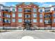 Stunning exterior of a brick condominium building with balconies and well-maintained landscaping at 20971 Shoreline Ct # 306, Noblesville, IN 46062