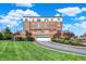 Brick condo building with well-manicured landscaping, attached garages and a circular driveway at 20971 Shoreline Ct # 306, Noblesville, IN 46062