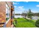 Lakefront exterior with well-manicured lawn, lush trees, and gorgeous lake view at 20971 Shoreline Ct # 306, Noblesville, IN 46062