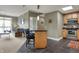 Stylish living area with modern furnishings that seamlessly integrates with the kitchen area at 20971 Shoreline Ct # 306, Noblesville, IN 46062