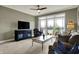Comfortable living room with entertainment center and access to the outdoor balcony with beautiful views at 20971 Shoreline Ct # 306, Noblesville, IN 46062