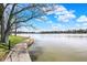 Beautiful lake view with a concrete walkway extending to the water's edge at 20971 Shoreline Ct # 306, Noblesville, IN 46062