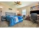 Bedroom with a ceiling fan and a bed in the center of the room at 218 E Mechanic St, Shelbyville, IN 46176