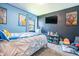 Bedroom features a large bed, window, and black accent wall at 218 E Mechanic St, Shelbyville, IN 46176