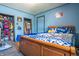 Bedroom showcasing a big bed with blue sheets and open closets at 218 E Mechanic St, Shelbyville, IN 46176