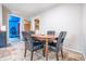 View of the dining area showcasing a table with chairs, hardwood flooring, and access to other rooms at 218 E Mechanic St, Shelbyville, IN 46176