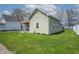 Charming home featuring a quaint covered porch, and a well-maintained green front yard at 218 E Mechanic St, Shelbyville, IN 46176