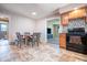 Eat-in kitchen features tile flooring, a black oven range, and leads into the living room with lots of space at 218 E Mechanic St, Shelbyville, IN 46176