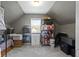 Finished attic used for storage, featuring ample shelving, window, and organized containers at 2225 Alabama St, Indianapolis, IN 46205