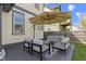Charming back patio area with comfortable seating, umbrella, and inviting outdoor space at 2225 Alabama St, Indianapolis, IN 46205