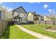 Expansive backyard featuring a well-maintained lawn, garden bed, and deck perfect for outdoor relaxation and entertainment at 2225 Alabama St, Indianapolis, IN 46205
