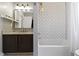 Bathroom featuring subway tile shower and granite vanity at 2225 Alabama St, Indianapolis, IN 46205