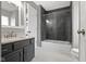 Bathroom featuring tiled shower, granite vanity, and modern fixtures at 2225 Alabama St, Indianapolis, IN 46205