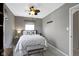 Cozy bedroom featuring a ceiling fan, plush carpet, and neutral decor at 2225 Alabama St, Indianapolis, IN 46205