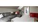 Versatile finished attic room with a modern workspace, comfortable seating, and stylish decor at 2225 Alabama St, Indianapolis, IN 46205