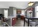 Well-appointed kitchen with stainless steel appliances and warm wood cabinetry at 2225 Alabama St, Indianapolis, IN 46205