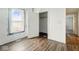 This bedroom features hardwood floors and natural light from a window at 2349 Indianapolis Ave, Indianapolis, IN 46208