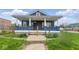 Charming home with a covered porch and steps to the front door at 2349 Indianapolis Ave, Indianapolis, IN 46208