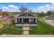 Inviting single-story home featuring a cozy front porch and a well-maintained front yard at 2349 Indianapolis Ave, Indianapolis, IN 46208
