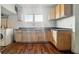 This kitchen includes ample cabinet space, a sink and view from the window at 2349 Indianapolis Ave, Indianapolis, IN 46208