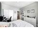 Inviting bedroom with a bright window, white furniture and ample closet space at 238 Switchgrass Ln, New Whiteland, IN 46184