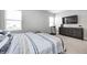 Inviting bedroom with a comfortable bed, neutral tones, and natural light from the windows at 238 Switchgrass Ln, New Whiteland, IN 46184