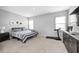 Cozy bedroom with a plush bed, soft carpet, and ample natural light from two windows at 238 Switchgrass Ln, New Whiteland, IN 46184