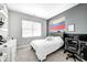 Cozy bedroom featuring neutral walls, bright window, and comfortable furnishings at 238 Switchgrass Ln, New Whiteland, IN 46184