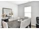 The dining room features a large wooden table with seating for eight and a decorative mirror at 238 Switchgrass Ln, New Whiteland, IN 46184