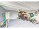 Spacious garage featuring epoxy flooring and ample storage space for tools and equipment at 238 Switchgrass Ln, New Whiteland, IN 46184