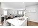 Open concept kitchen island view into the living room and dining area at 238 Switchgrass Ln, New Whiteland, IN 46184