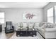Comfortable living room with a large sectional sofa, plush rug, and modern decor creating a cozy atmosphere at 238 Switchgrass Ln, New Whiteland, IN 46184