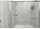 Modern tiled shower with glass door and shower head at 238 Switchgrass Ln, New Whiteland, IN 46184