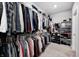 Organized walk-in closet featuring shelving, hanging rods, and ample space for clothing and accessories at 238 Switchgrass Ln, New Whiteland, IN 46184