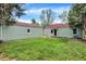 Spacious backyard with a detached garage, ideal for outdoor activities and storage at 2404 Wildwood Ave, Anderson, IN 46011
