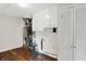 Utility room features white cabinets, gray walls, laminate floors, and an efficient furnace system at 2404 Wildwood Ave, Anderson, IN 46011