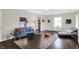 Bright living room featuring modern furnishings, a stylish rug, and beautiful hardwood floors at 2404 Wildwood Ave, Anderson, IN 46011