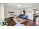Spacious living room with hardwood floors, stylish furnishings, and ample natural light at 2404 Wildwood Ave, Anderson, IN 46011