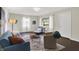 Inviting living room with large windows, comfortable seating, and stylish decor at 2404 Wildwood Ave, Anderson, IN 46011