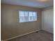 Neutral bedroom featuring a double window and closet for storage and functionality at 2465 N Eaton Ave, Indianapolis, IN 46219