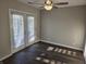 Bedroom features new wood-look flooring and French doors leading to outdoor area at 2465 N Eaton Ave, Indianapolis, IN 46219