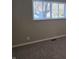Close up of a bedroom window with a tree blocking the view of the outside at 2465 N Eaton Ave, Indianapolis, IN 46219