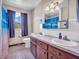 Bright bathroom includes dual sinks, vanity with storage, and shower with decorative curtain at 257 N Letterman Rd, Paragon, IN 46166