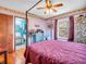 Comfortable bedroom with hardwood floors, a four-poster bed, and access to a bathroom at 257 N Letterman Rd, Paragon, IN 46166