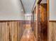 Hallway featuring wood paneled walls and doors at 257 N Letterman Rd, Paragon, IN 46166